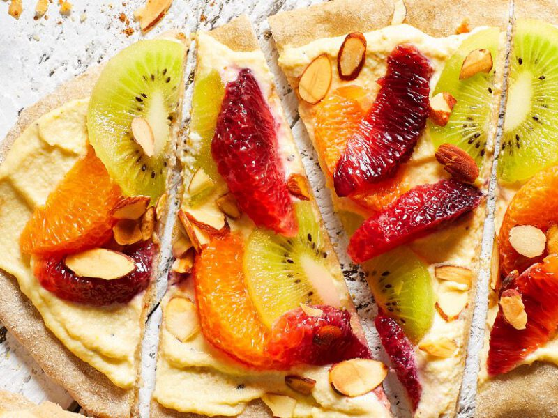 flatbreads with sliced kiwi and oranges