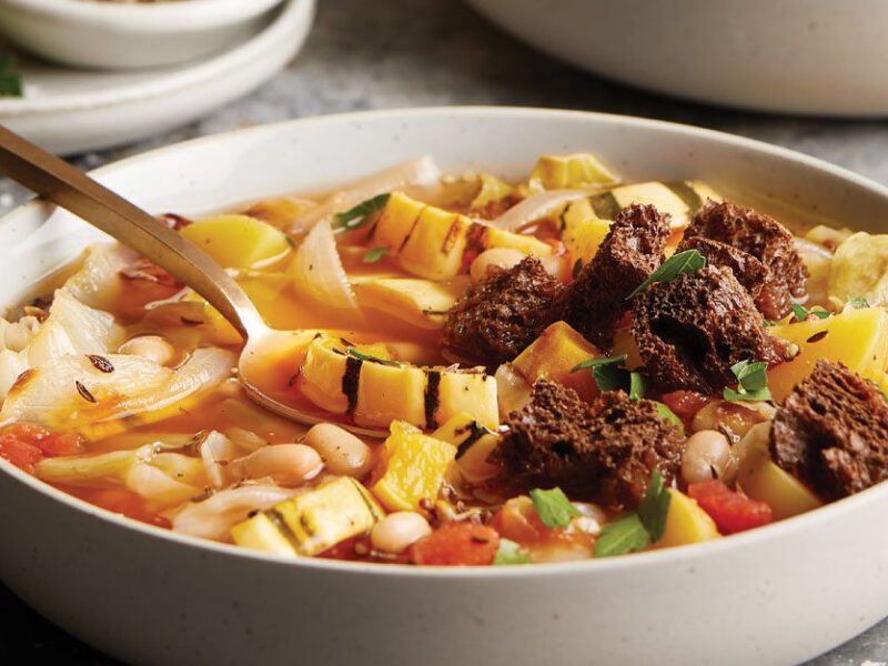 Delicata Squash and Roasted Cabbage Stew in a white bowl