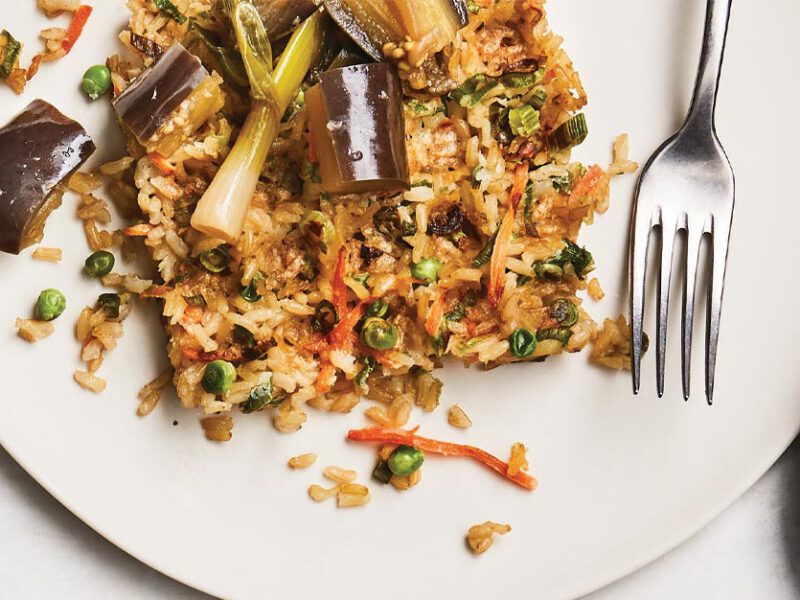 Fried Rice Waffles with Silken Braised Eggplant on a white plate with a metal fork
