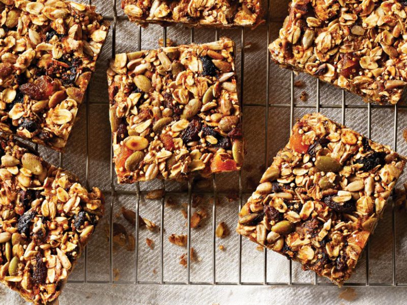 Crunchy Grain, Seed, and Dried Fruit Bars on a metal cooling rack