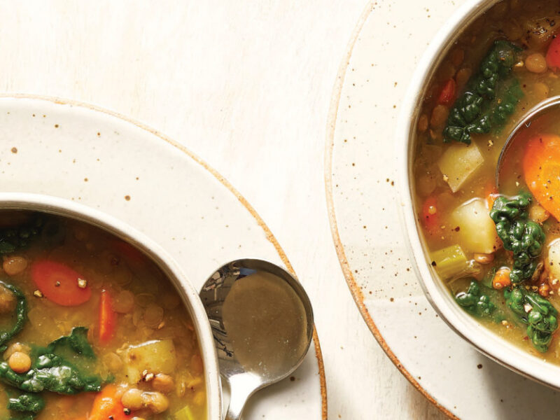 Two bowls of 8-Ingredient Lentil Soup with Potatoes and Kale