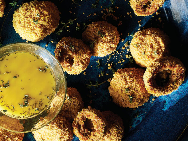 Breaded Mushrooms next to a small glass bowl of White Balsamic Vinaigrette