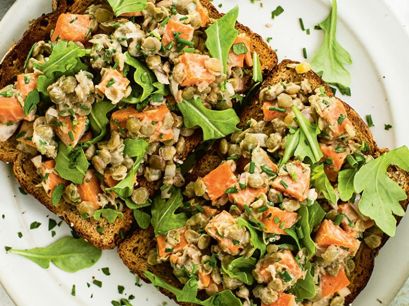 To slices of whole grain toast topped with Maple Mustard Lentils, Sweet Potatoes, and Herbs