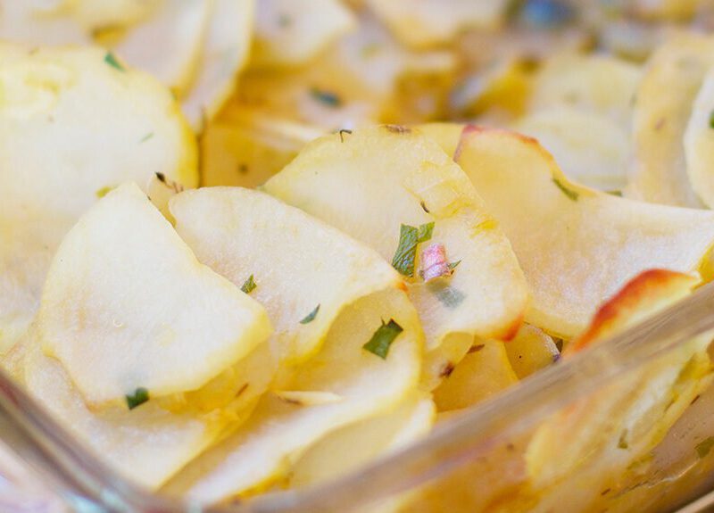 Boulangere Potatoes in a white casserole dish