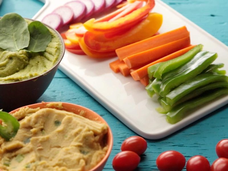 creamy oil-free hummus shown alongside a tray of crudites