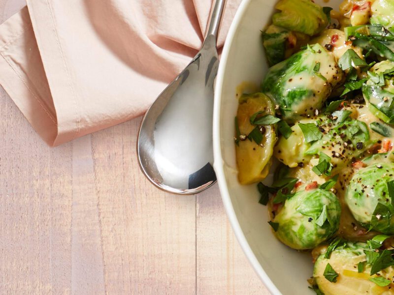 A bowl of Creamy Brussels Sprouts with sun-dried tomatoes
